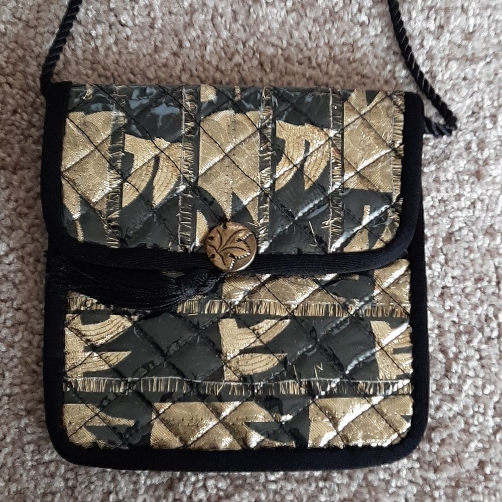 Gold and black crossbody handbag